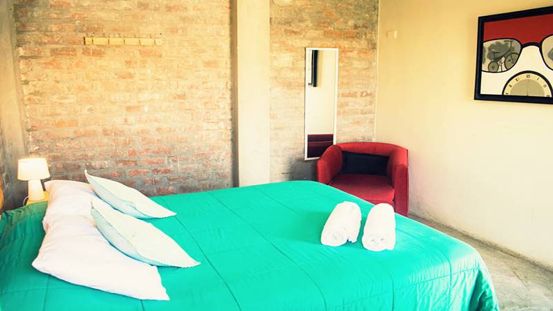 Eco-friendly hostel, Ica, Peru,The Upcycled Hostel, Peru, green oasis in Ica, sustainable living Ica, green travel Ica, Peru, sustainable practices in hostels, green hostel experience Ica, eco-luxury in Ica, Peru, OMG Hostels, Ica Peru.